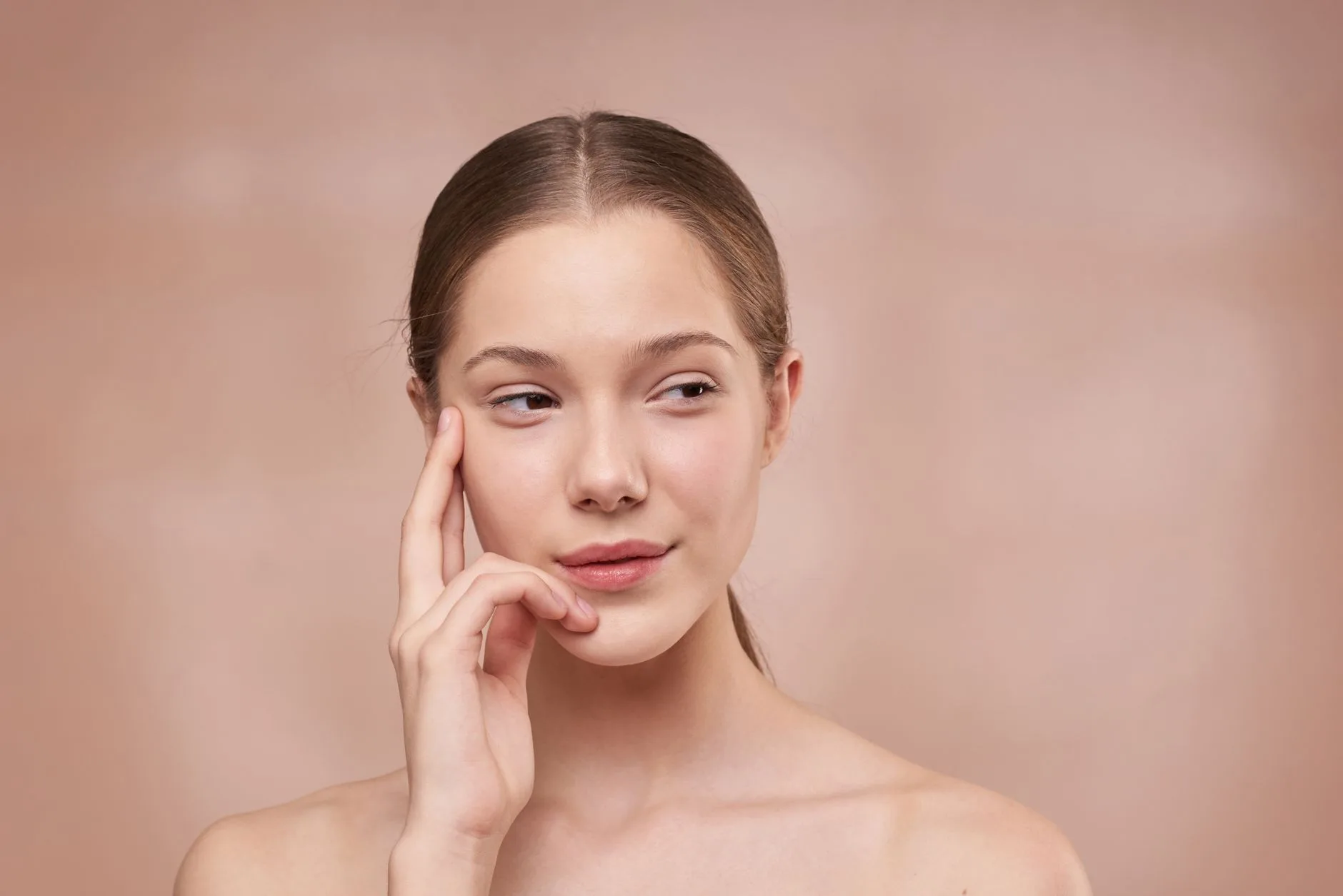 Woman with glowing skin showcasing natural skincare results
