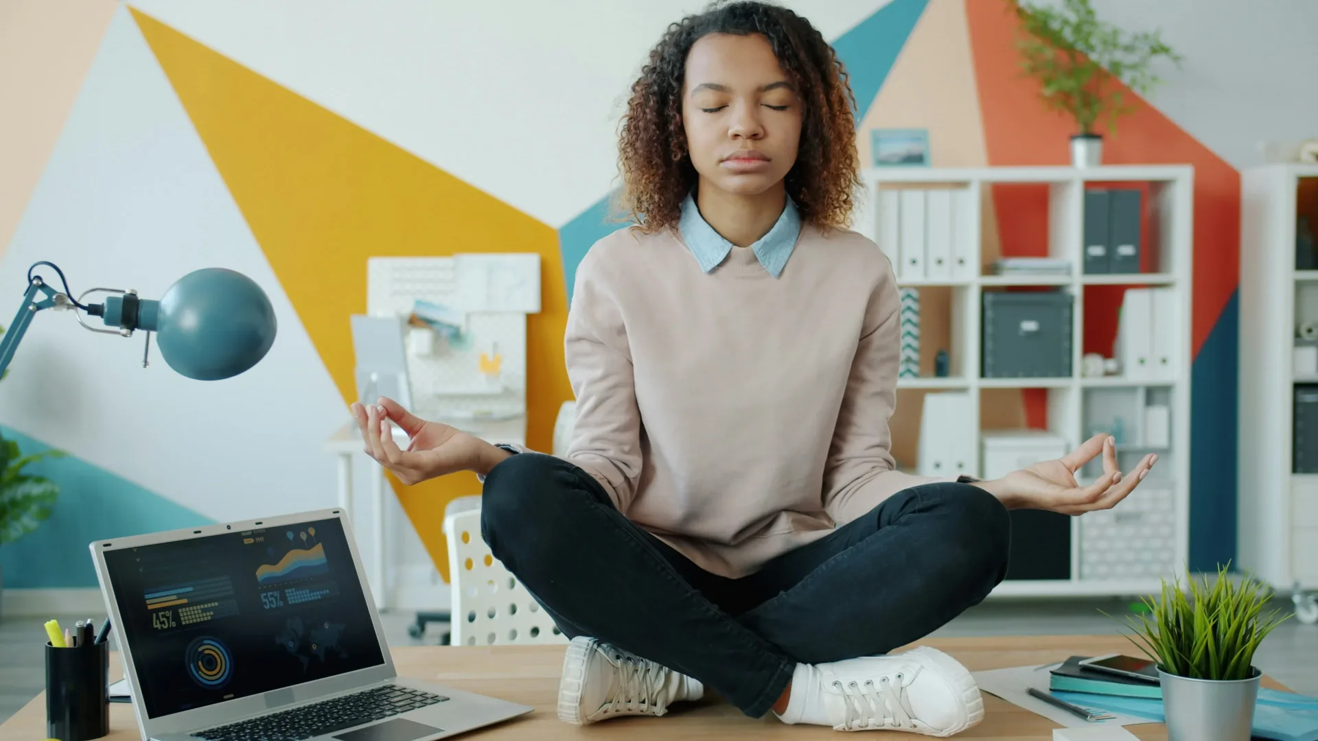 Person sitting quietly in a supportive wellbeing consultation space