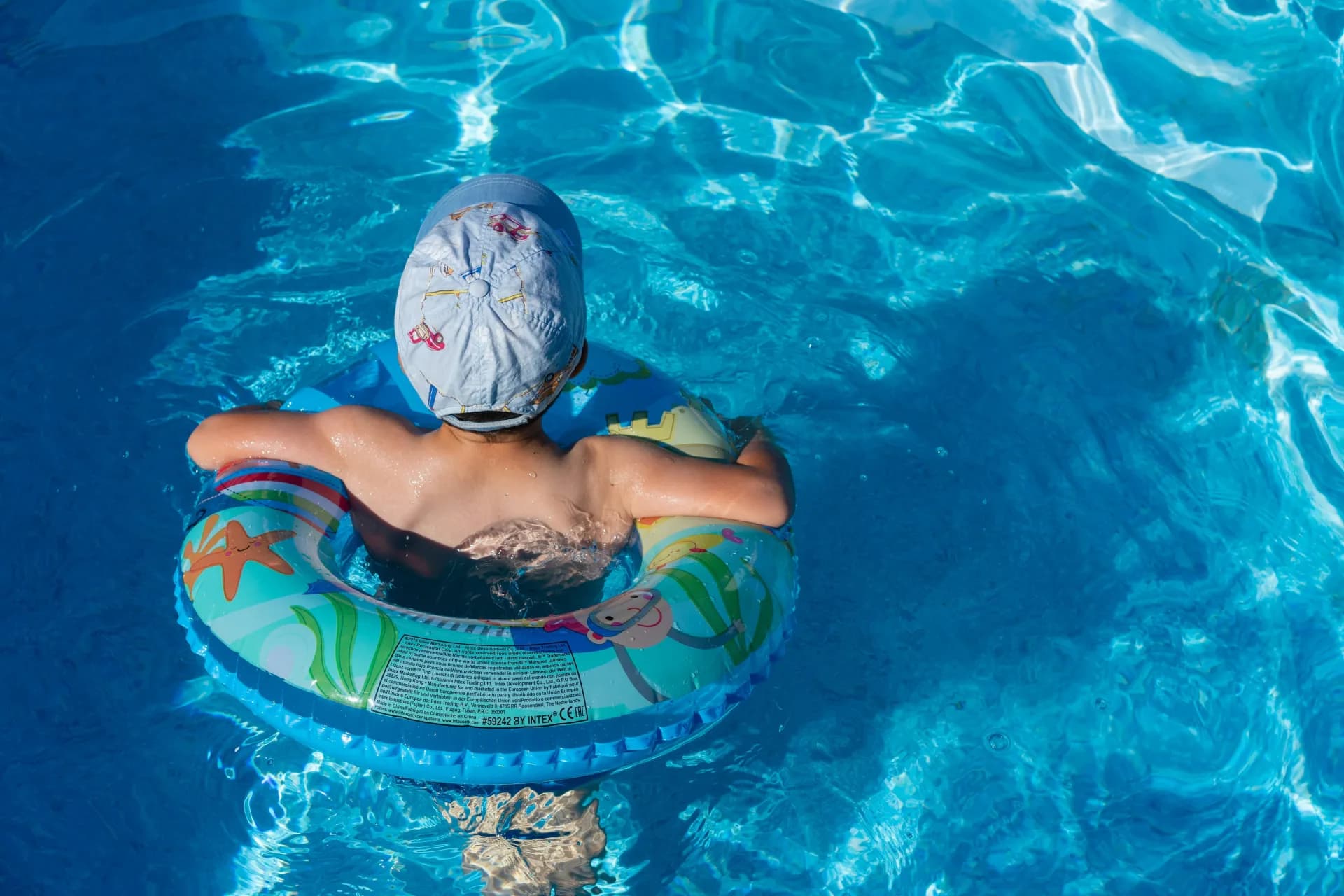 Child gaining confidence during a swimming lesson