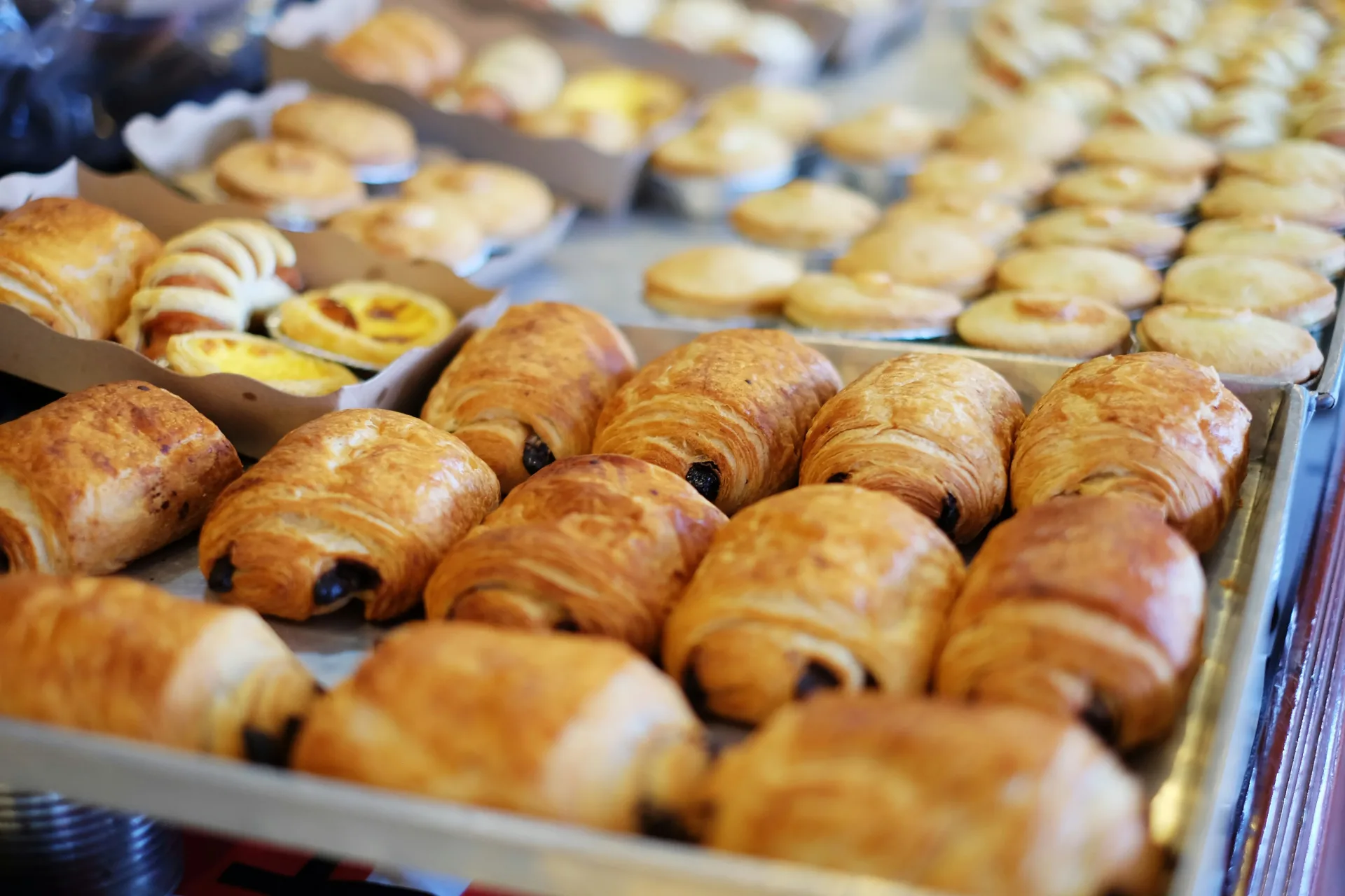 Assorted pastries displayed on a bakery tray