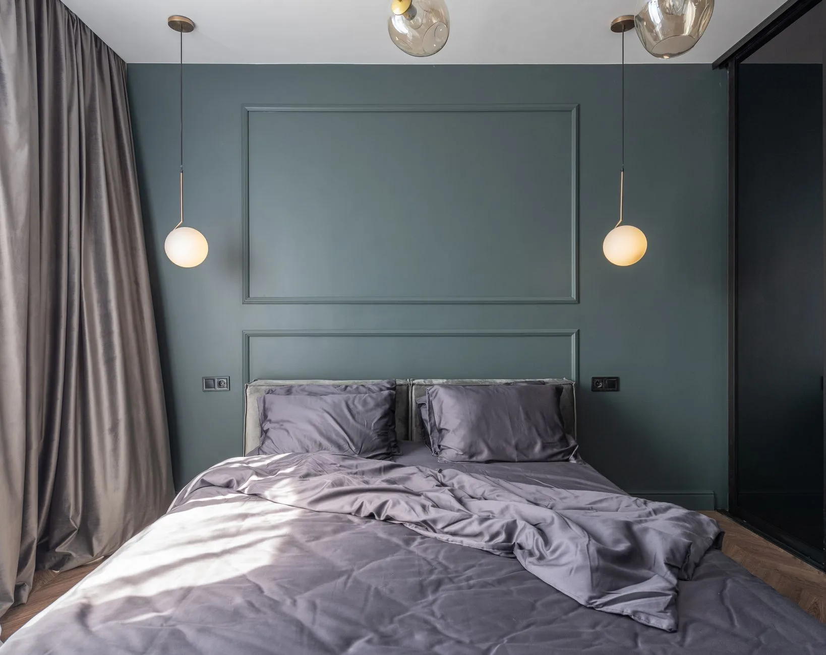 Serene minimalist bedroom with neutral tones and curated lighting