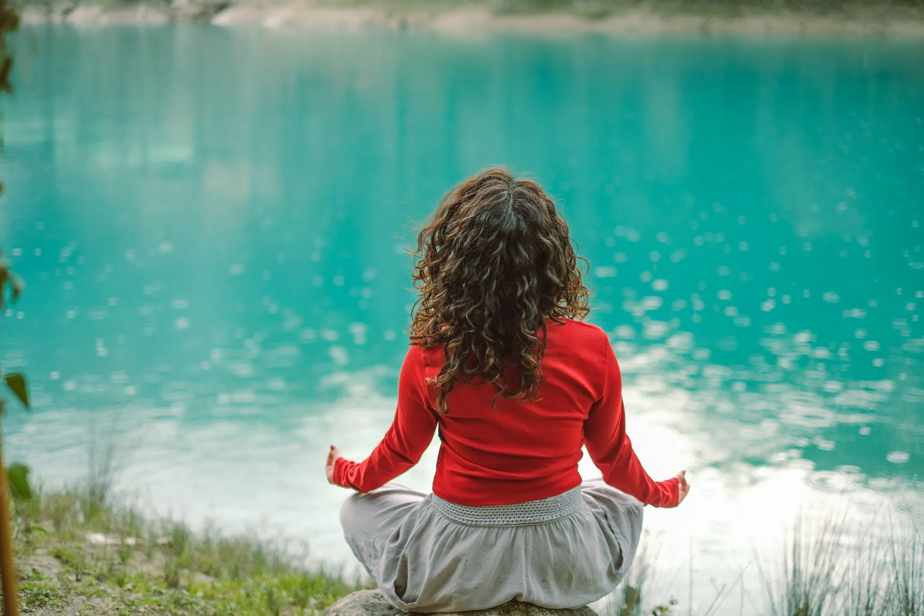 Person meditating in a calm, sunlit space
