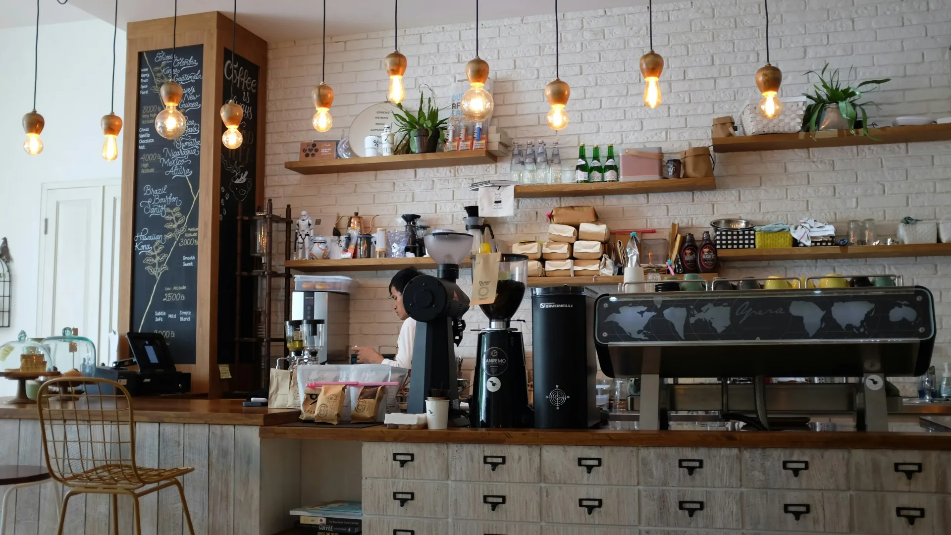 Warm Bristol coffee shop interior with wooden counter, espresso machine and seating